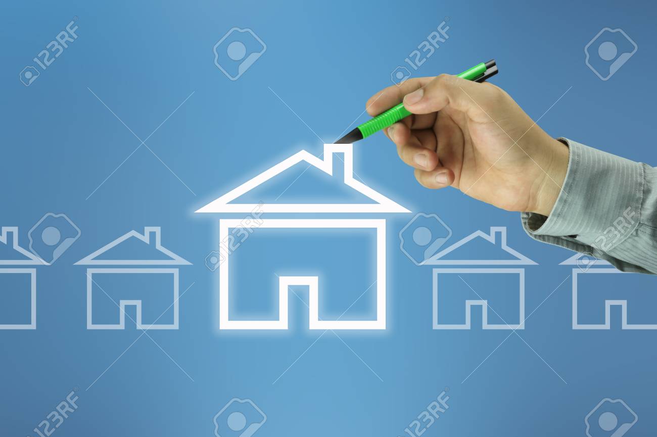 Hand of a businessman holding a green pen pointing to a home symbol